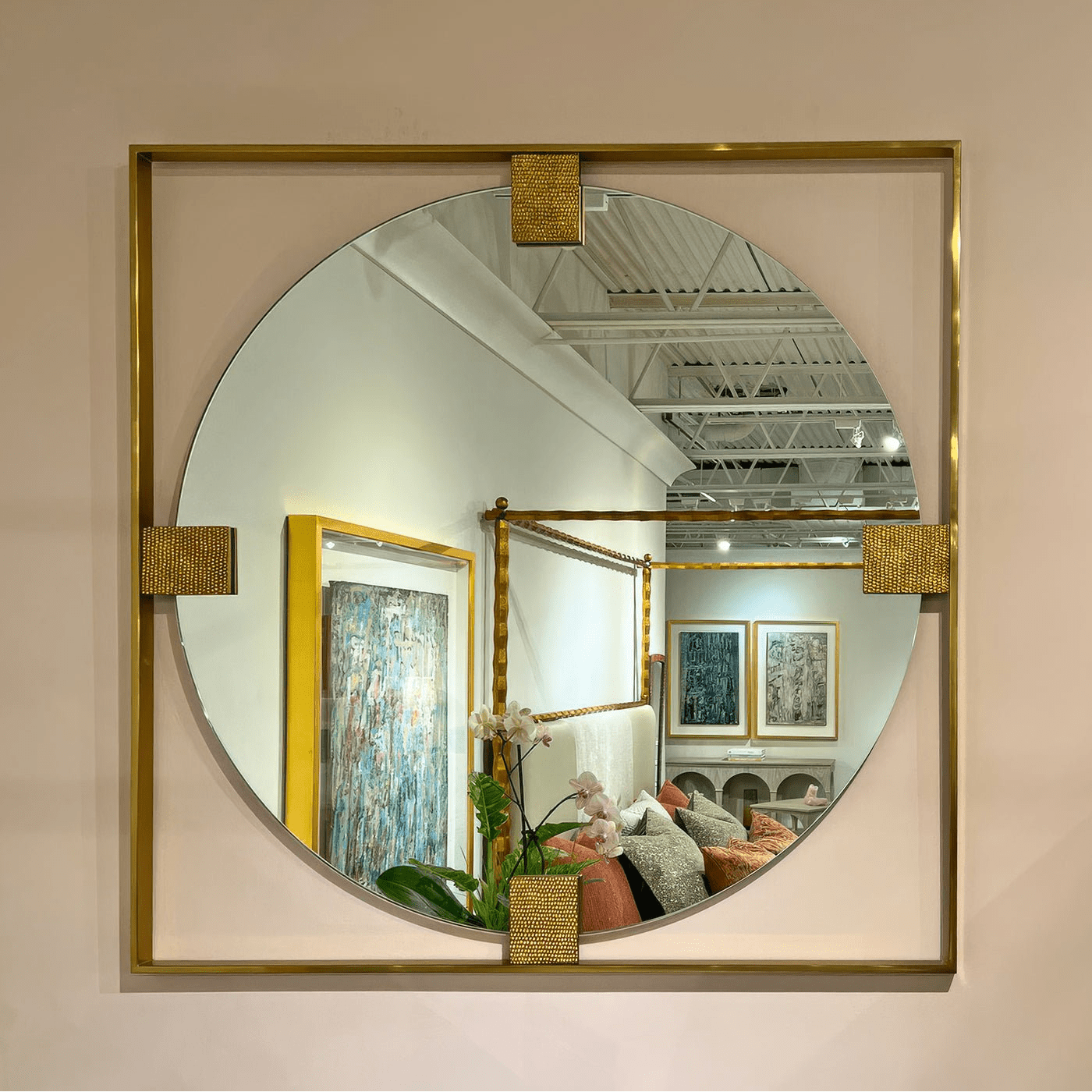 Art Deco brass mirror reflecting interior decor and lighting.