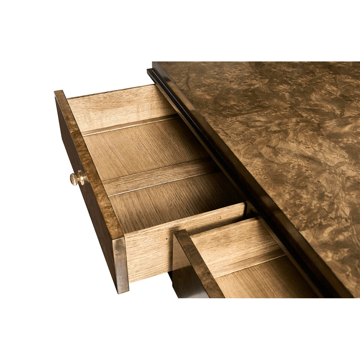 Open top drawer of burl wood dresser, interior view.