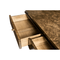 Open top drawer of burl wood dresser, interior view.