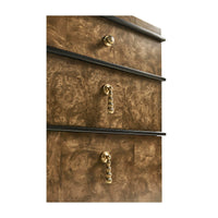Close-up on dresser's golden handles and texture.