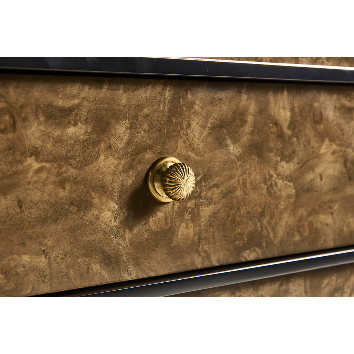 Close-up of burl wood knob on the dresser.