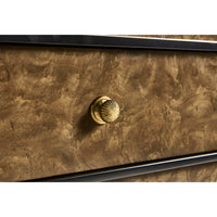 Close-up of burl wood knob on the dresser.