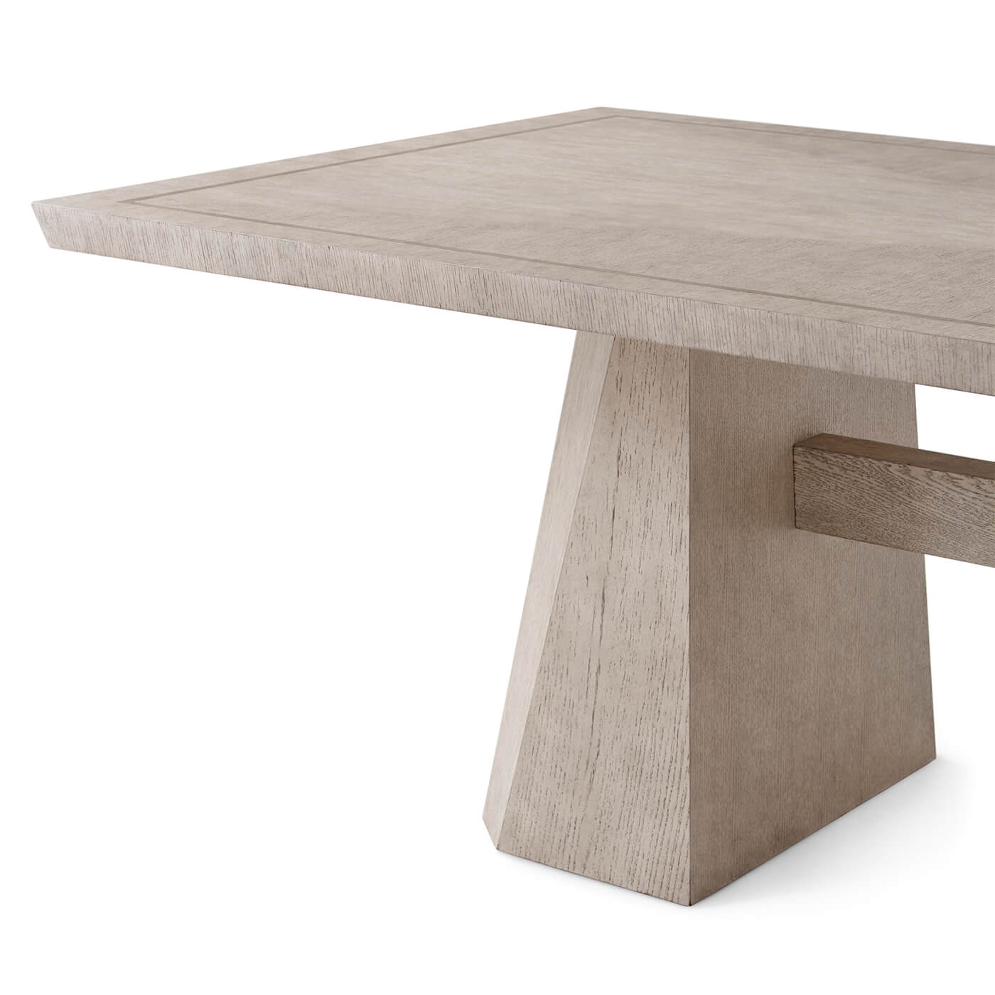 Close-up of light oak dining table leg design.