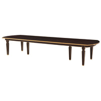 Long extension dining table, dark wood, angled view.