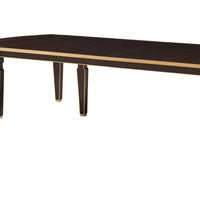 Close-up of dark wood dining table surface.