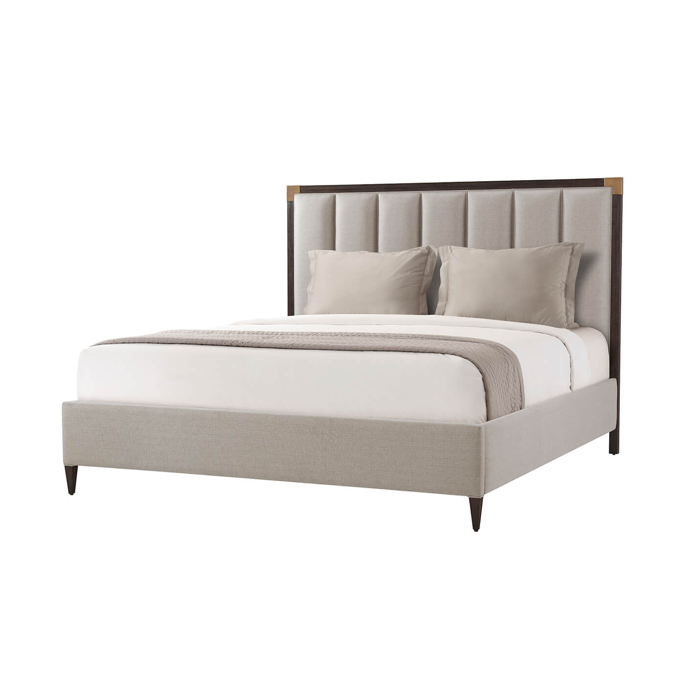 Art Deco king bed with pillows and bedding.