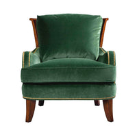 Green velvet accent chair, front view.