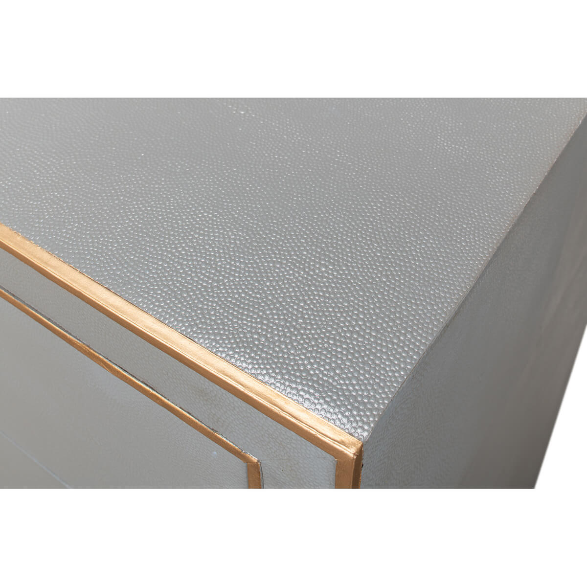 Close-up of textured dresser top, Art Deco style.