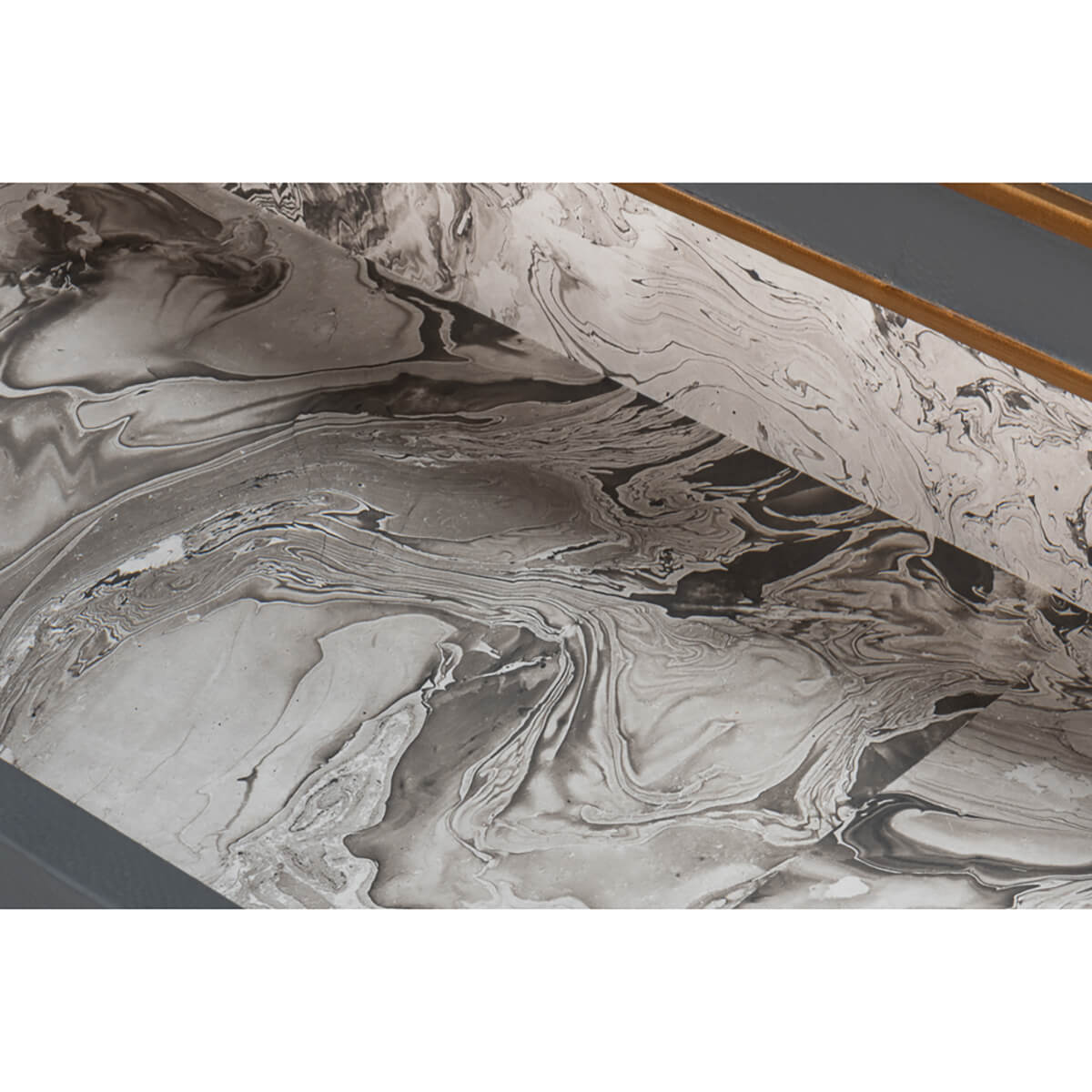 Marbled design inside grey dresser drawer.
