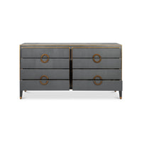 Open drawers grey dresser, brass handles.