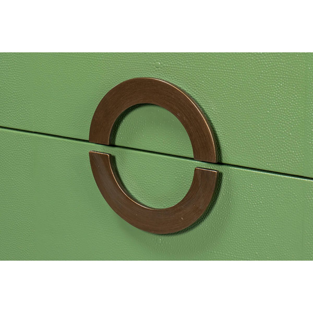 Close-up of dresser bronze circular handle detail.
