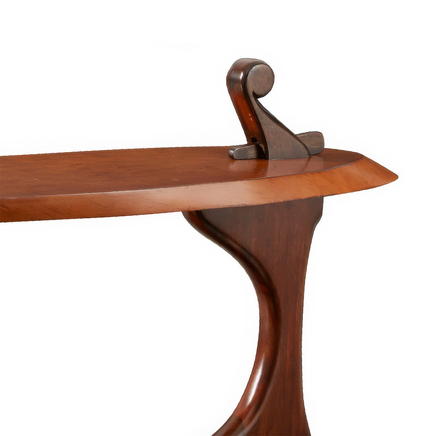 Close-up of table's detailed wood craftsmanship.