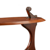 Close-up of table's detailed wood craftsmanship.