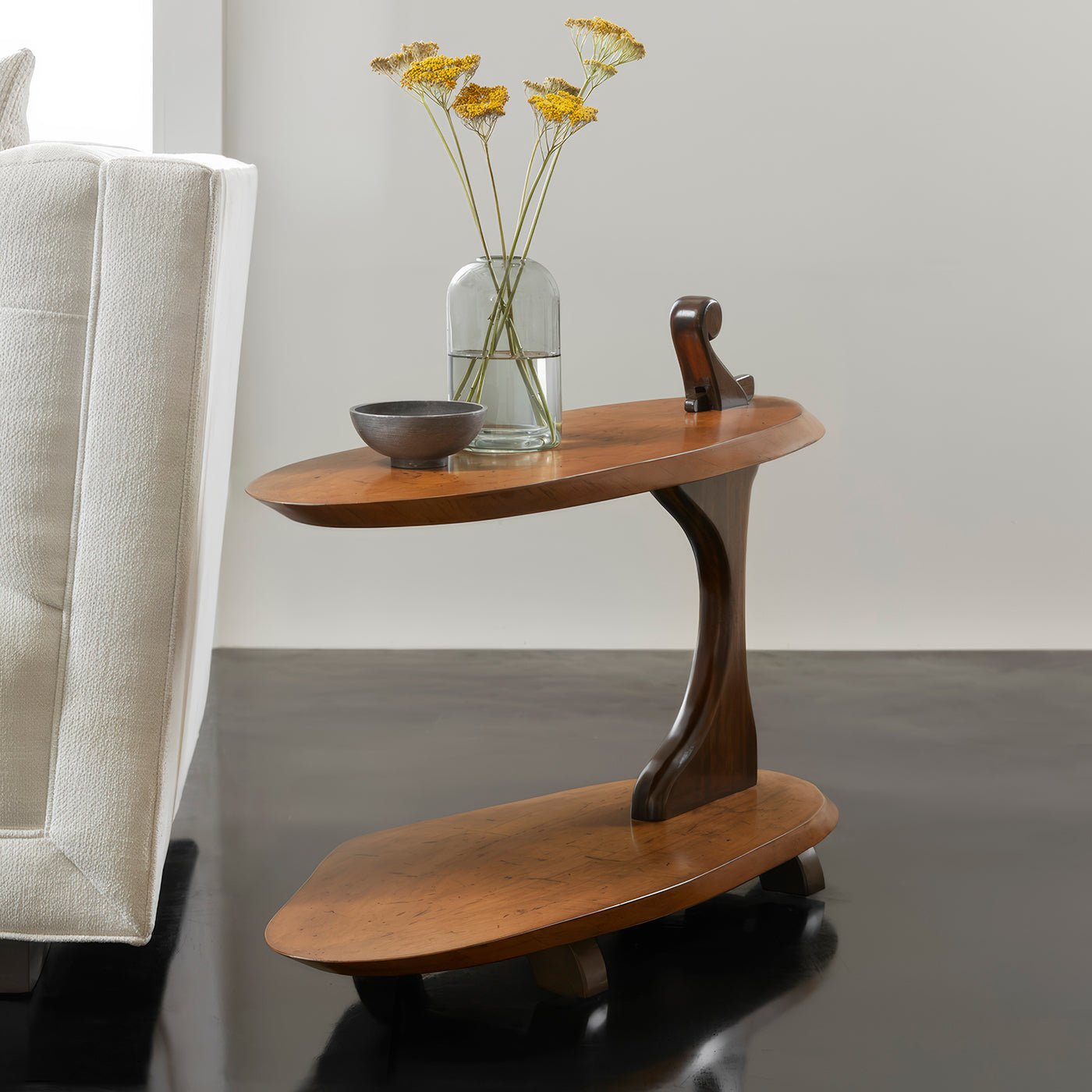 Accent table styled with decor in living room.