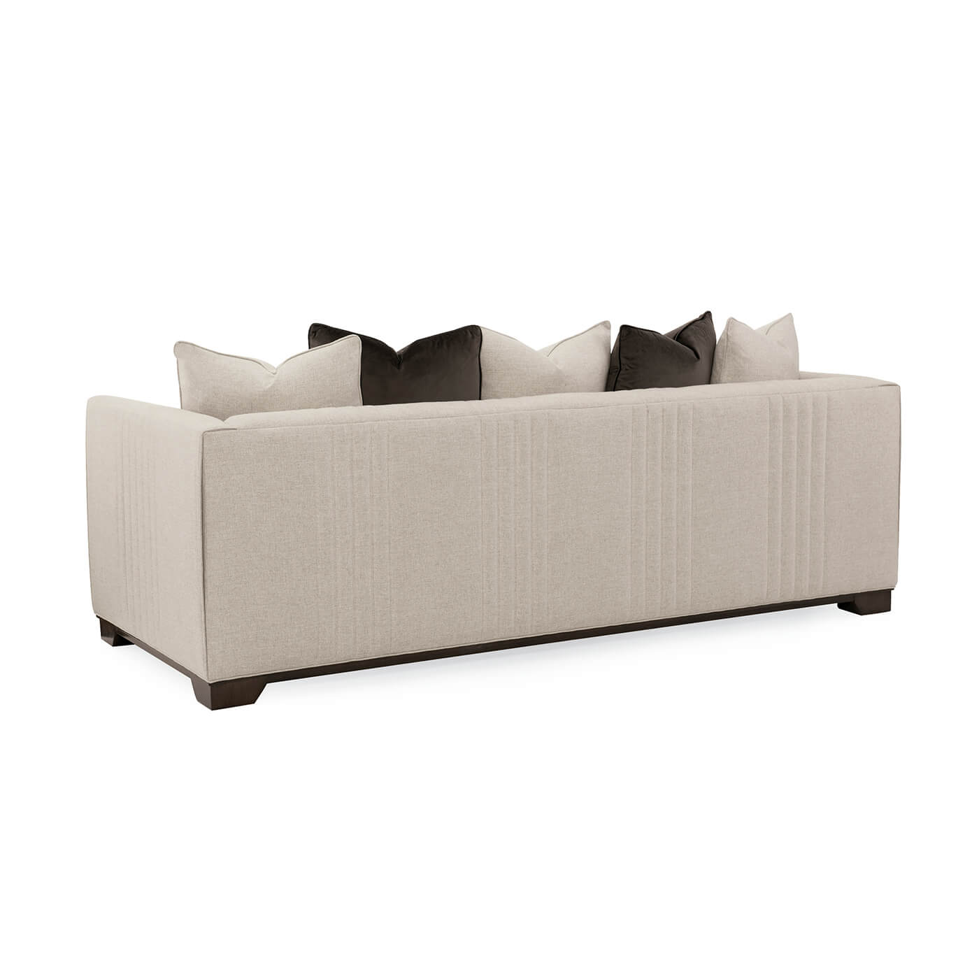 Beige sofa with pillows, back view.