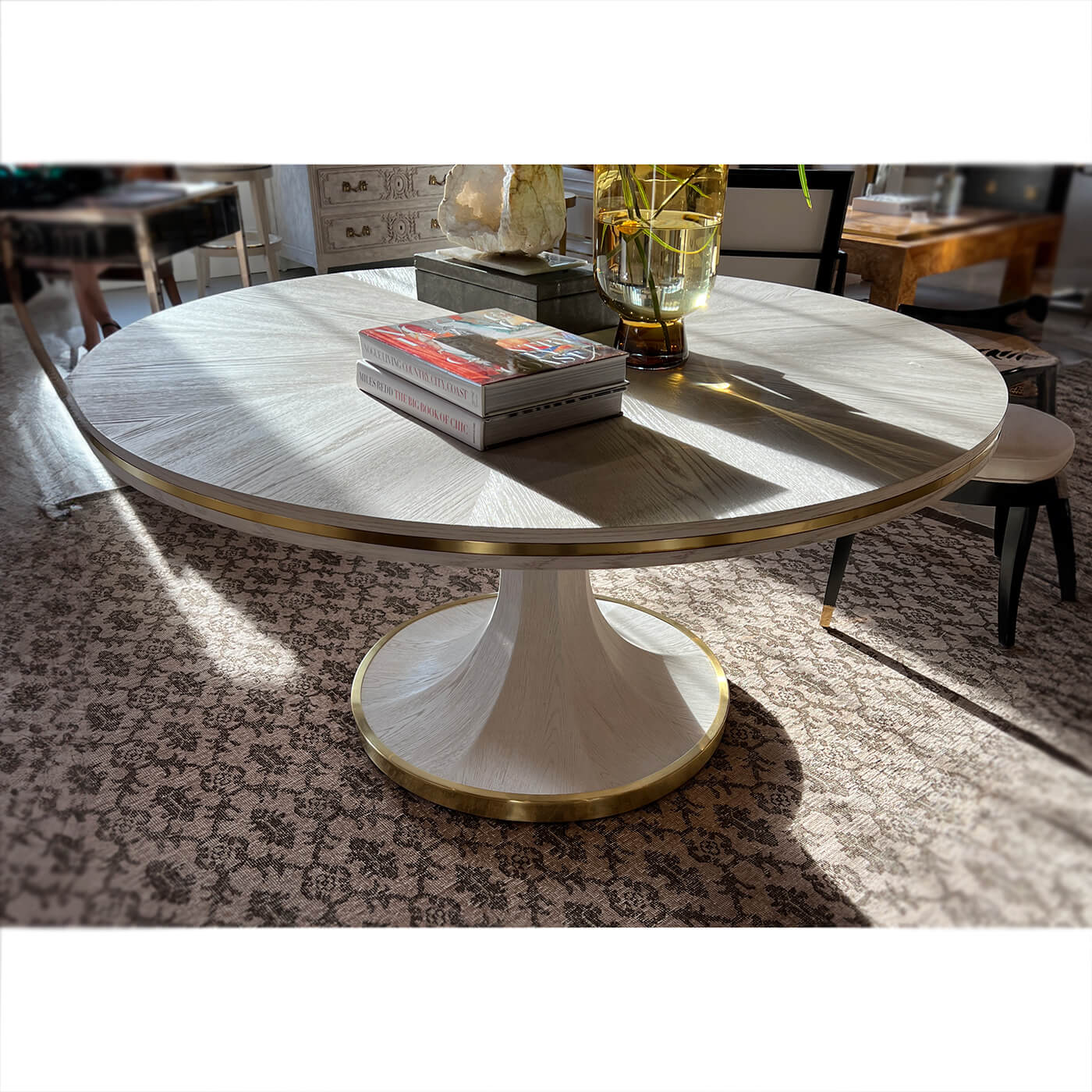 Stylish white dining table in sunlit interior setting.