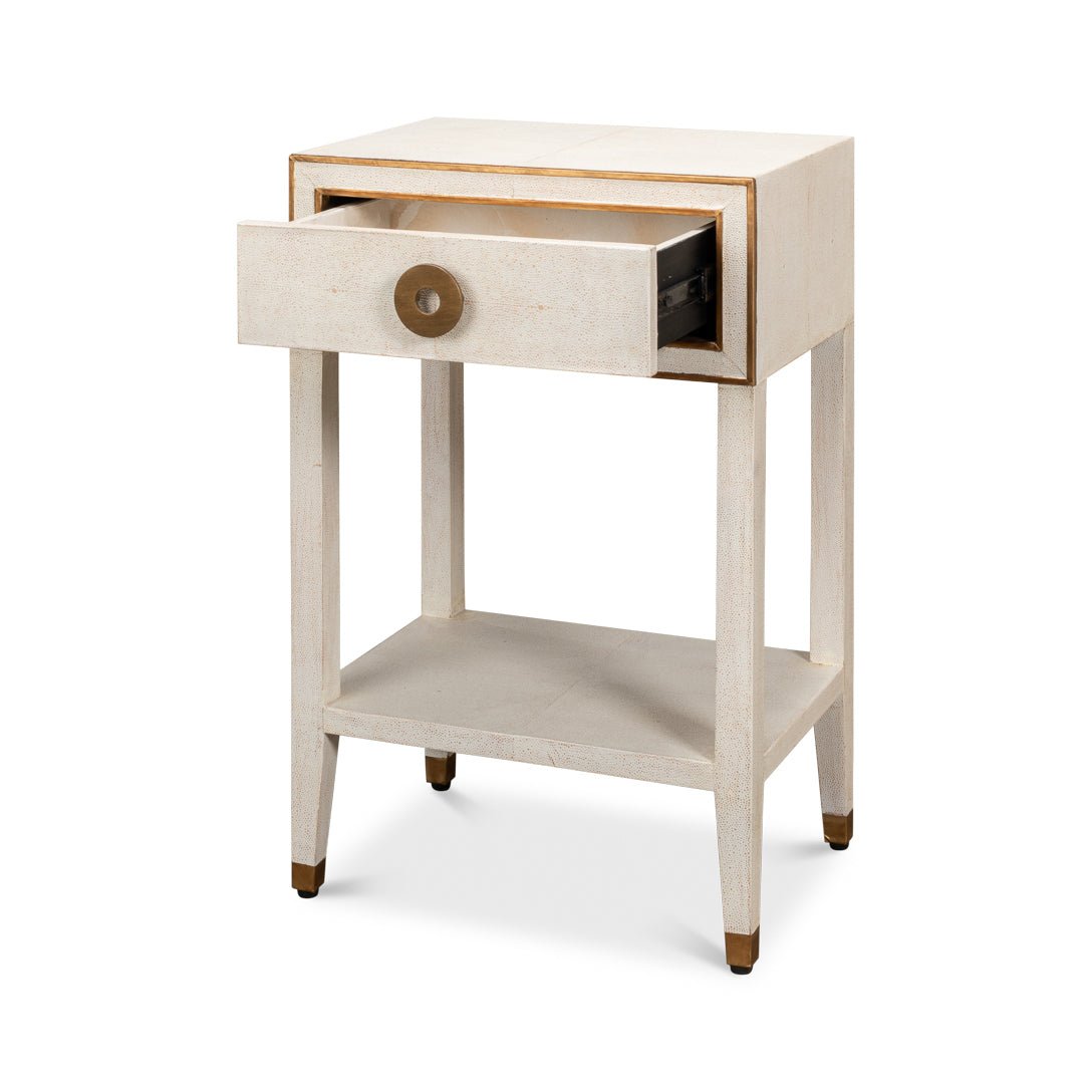 Art Deco white nightstand with drawer open.