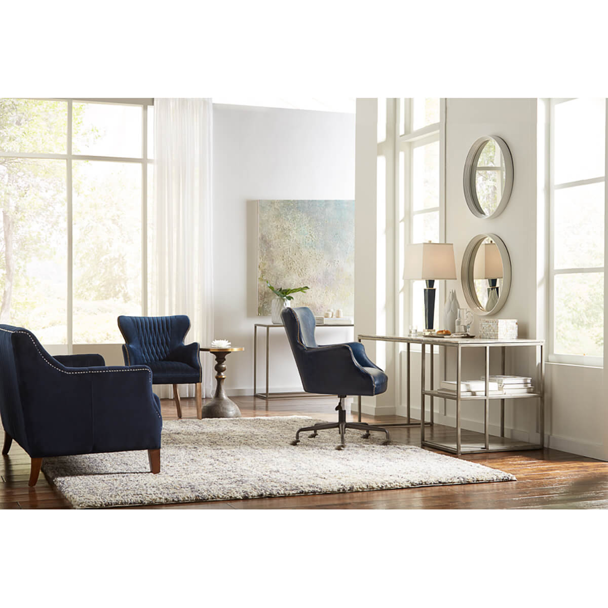Room with Artisan accent table and elegant furniture.