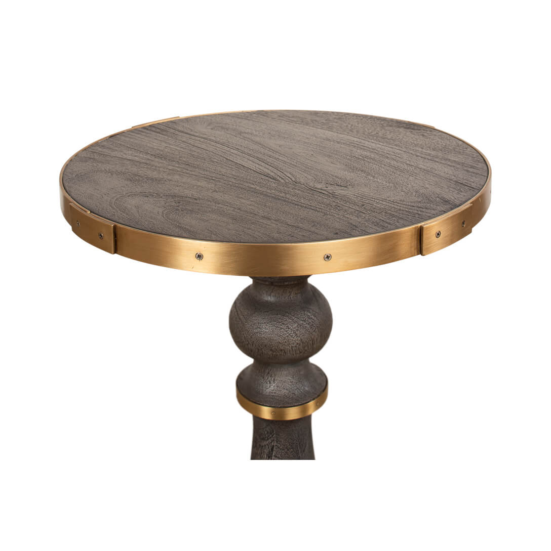 Top close-up of Artisan accent table's brass trim.