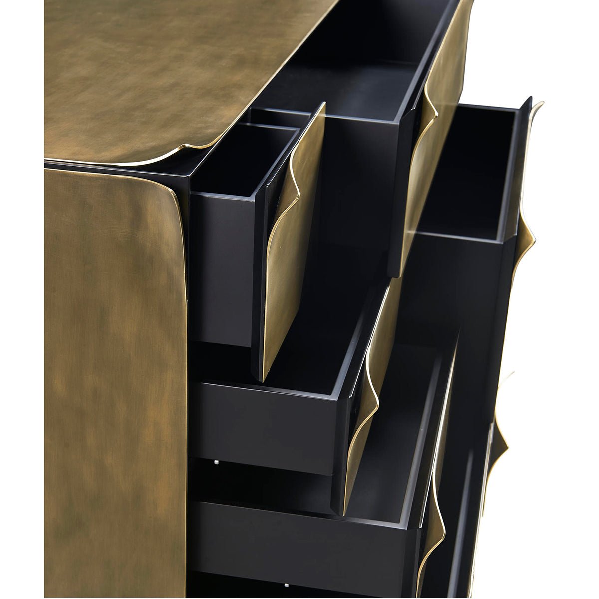 Top view of brass dresser, multiple open drawers.