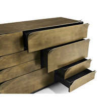 Close-up of brass dresser, open side drawers.
