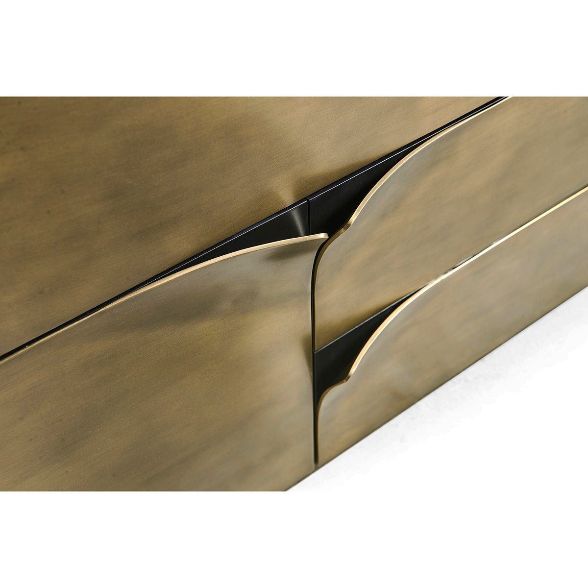 Close-up of brass dresser, drawer edges detail.
