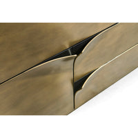Close-up of brass dresser, drawer edges detail.