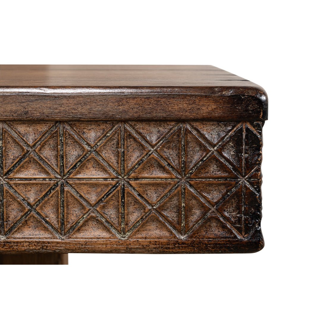 Edge design close-up of carved console table.