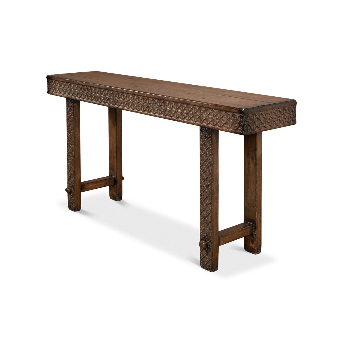 Angled view of carved console table, showcasing leg detail.