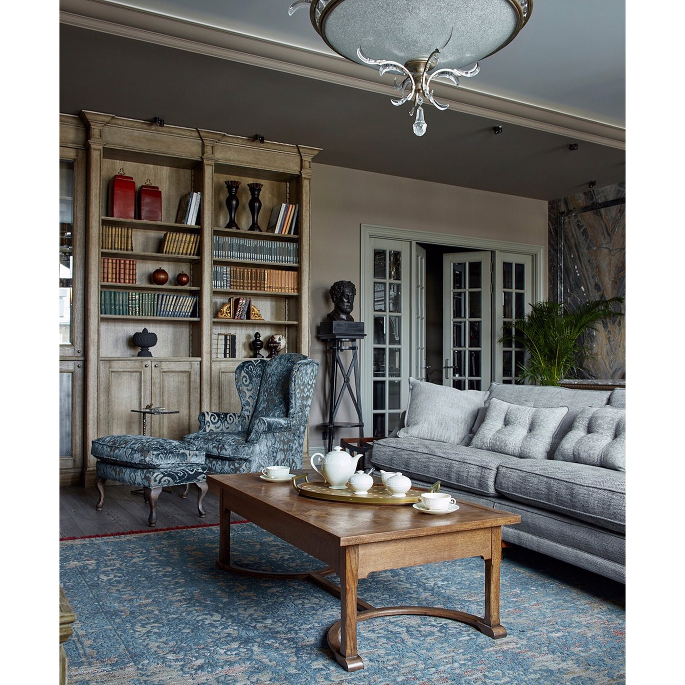 Oak coffee table styled in elegant living room setting.