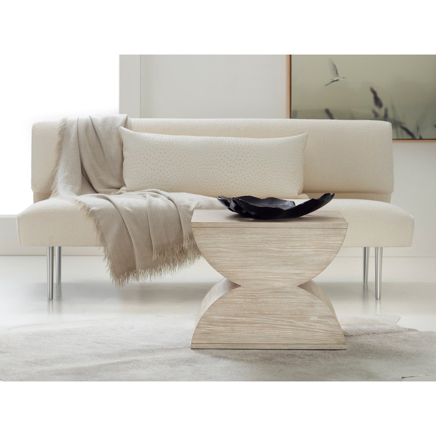 Geometric accent table in modern living room setting.