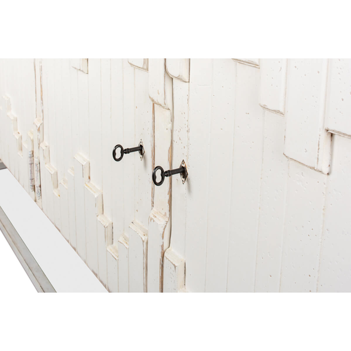 Aztec sideboard keyholes, detailed door design, close-up.