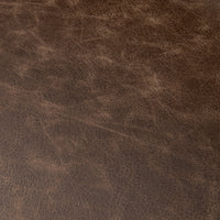 Dark brown leather upholstery swatch showing the backless counter stool’s natural grain and color variation.