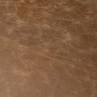 Tan leather upholstery swatch showing the backless counter stool’s natural grain and color variation.