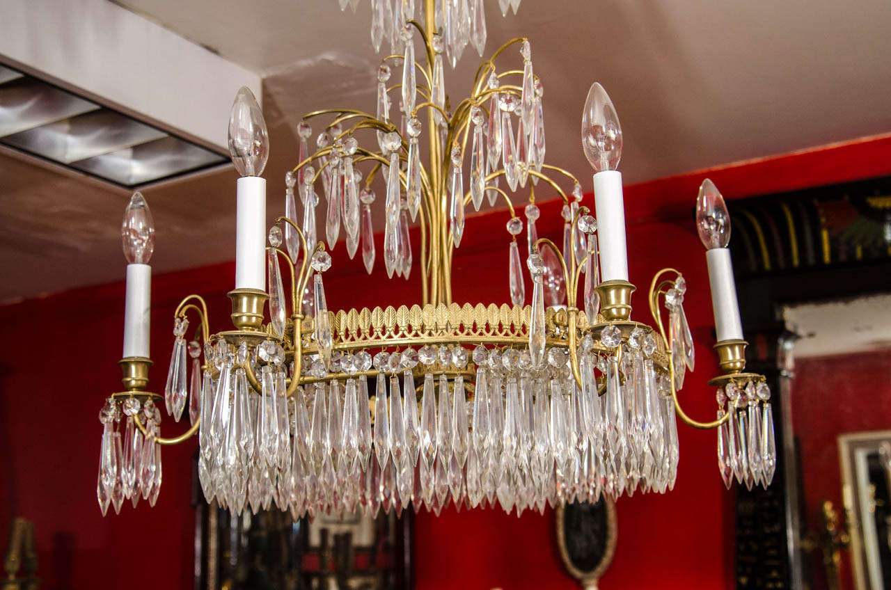 Baltic Six Light Chandelier with crystal and gold accents.