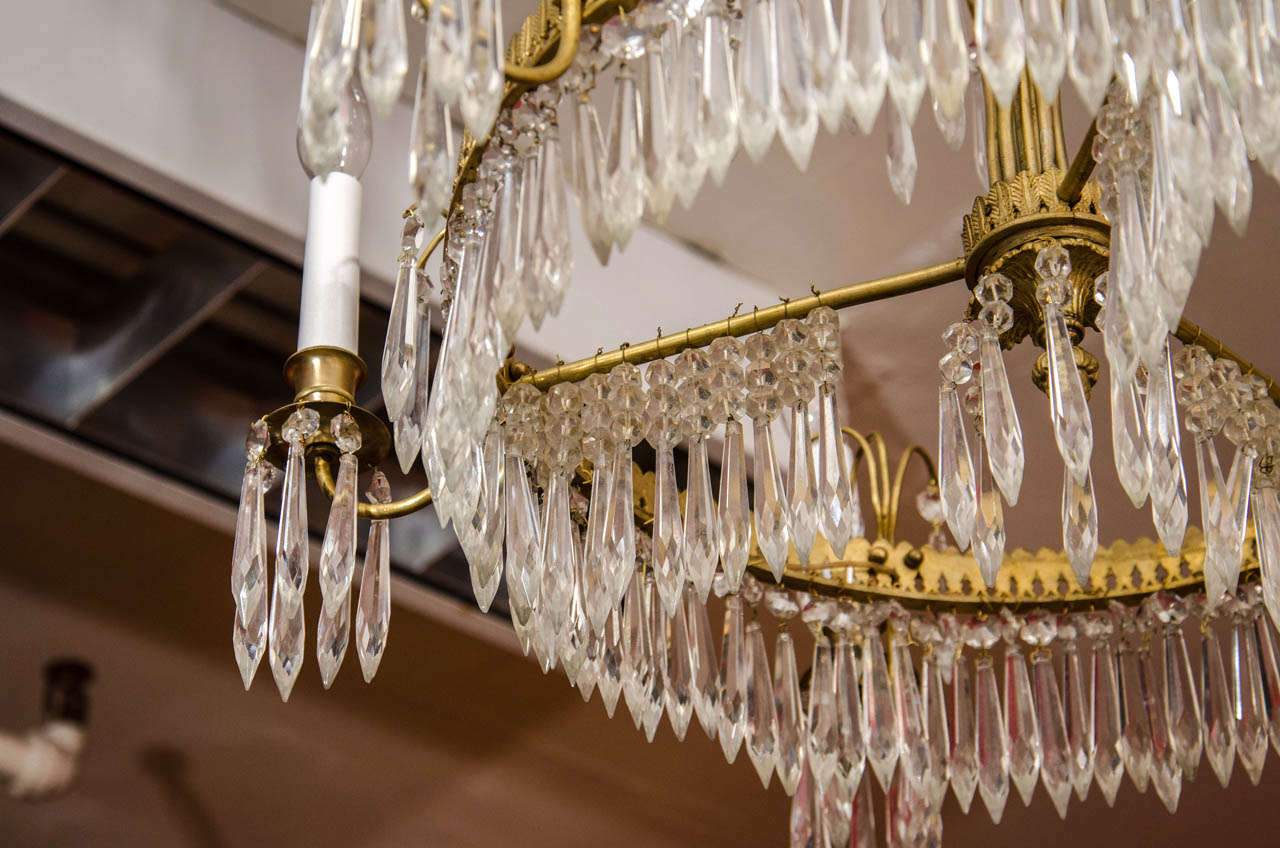 Close-up of hanging crystals on Baltic Six Light Chandelier.