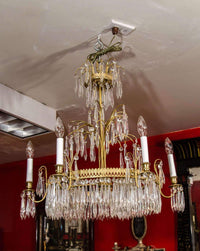 Baltic Six Light Chandelier installed in red room.