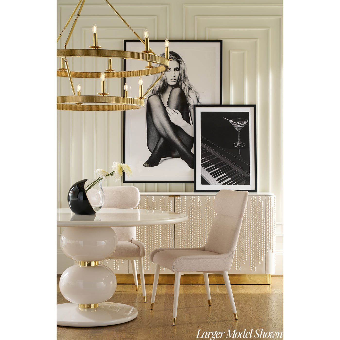 Beaded cabinet in elegant dining room, artwork above.