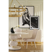 Beaded cabinet in elegant dining room, artwork above.