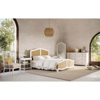 Room setting with French Provincial bed and dresser.