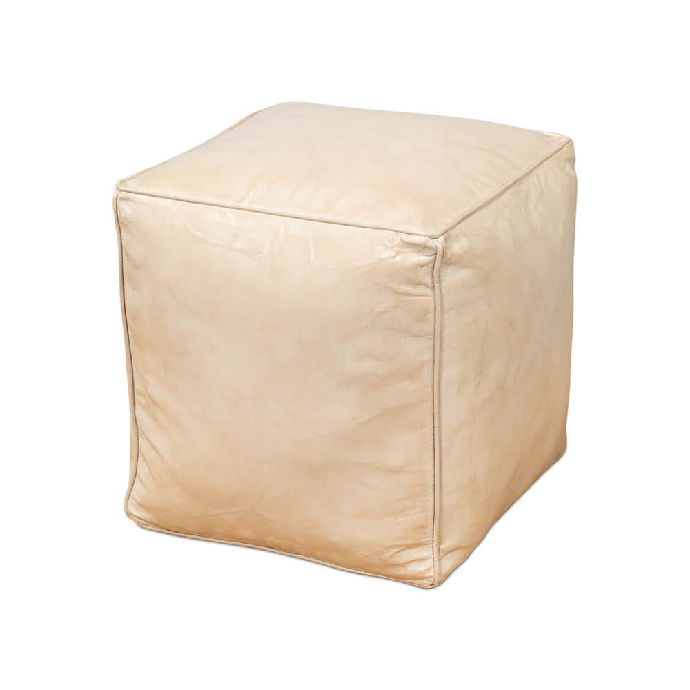 Beige leather cube stool, front angle view.