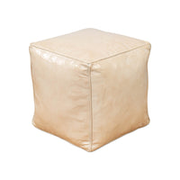 Beige leather cube stool, side angle perspective.