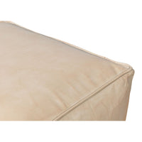 Beige leather cube stool, detailed edge view.