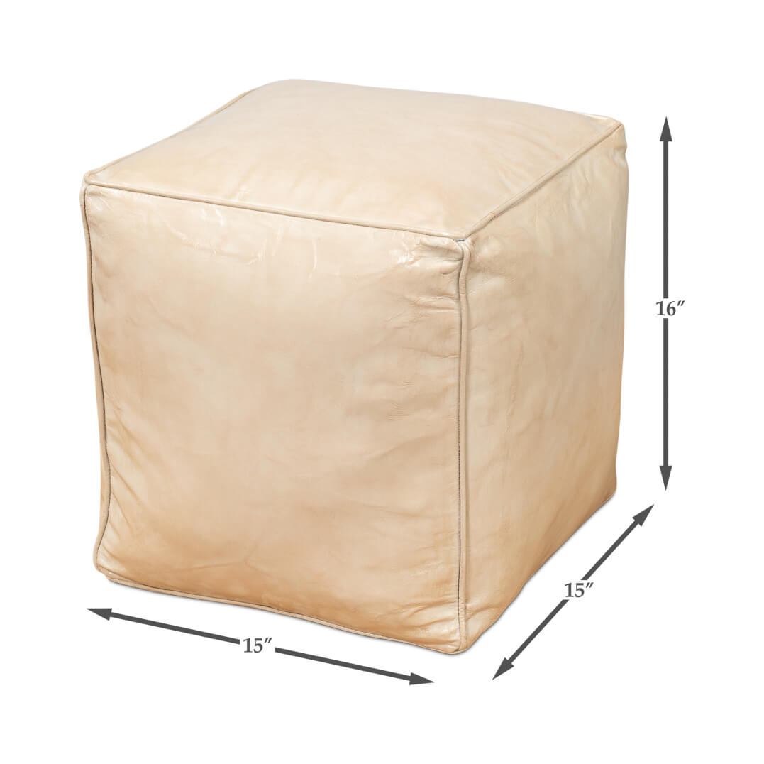 Beige leather cube stool, dimensions shown with arrows.