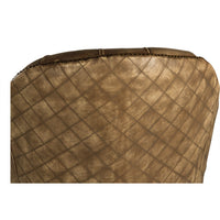Detail of quilted leather back of chair.