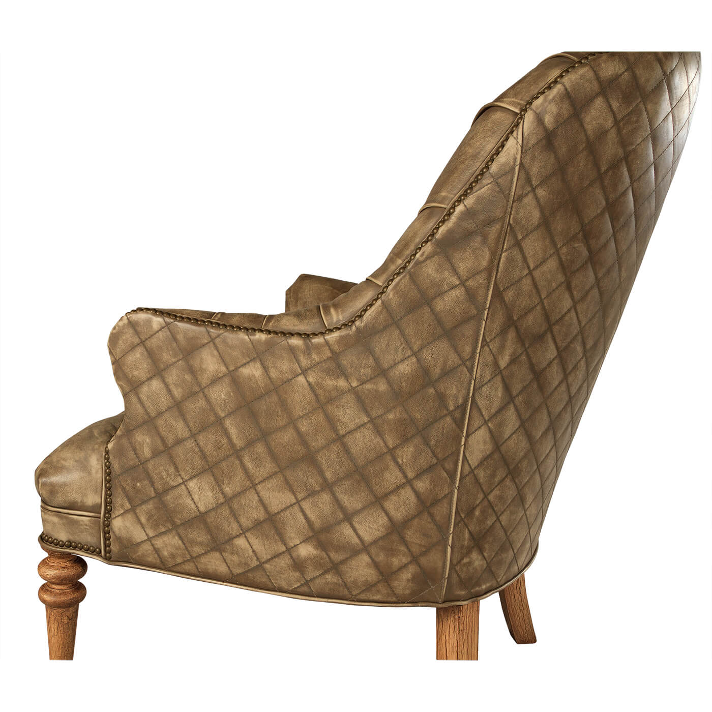 Side angle highlighting chair's quilted leather pattern.