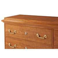 Top section of Biedermeier dresser showing wood grain.