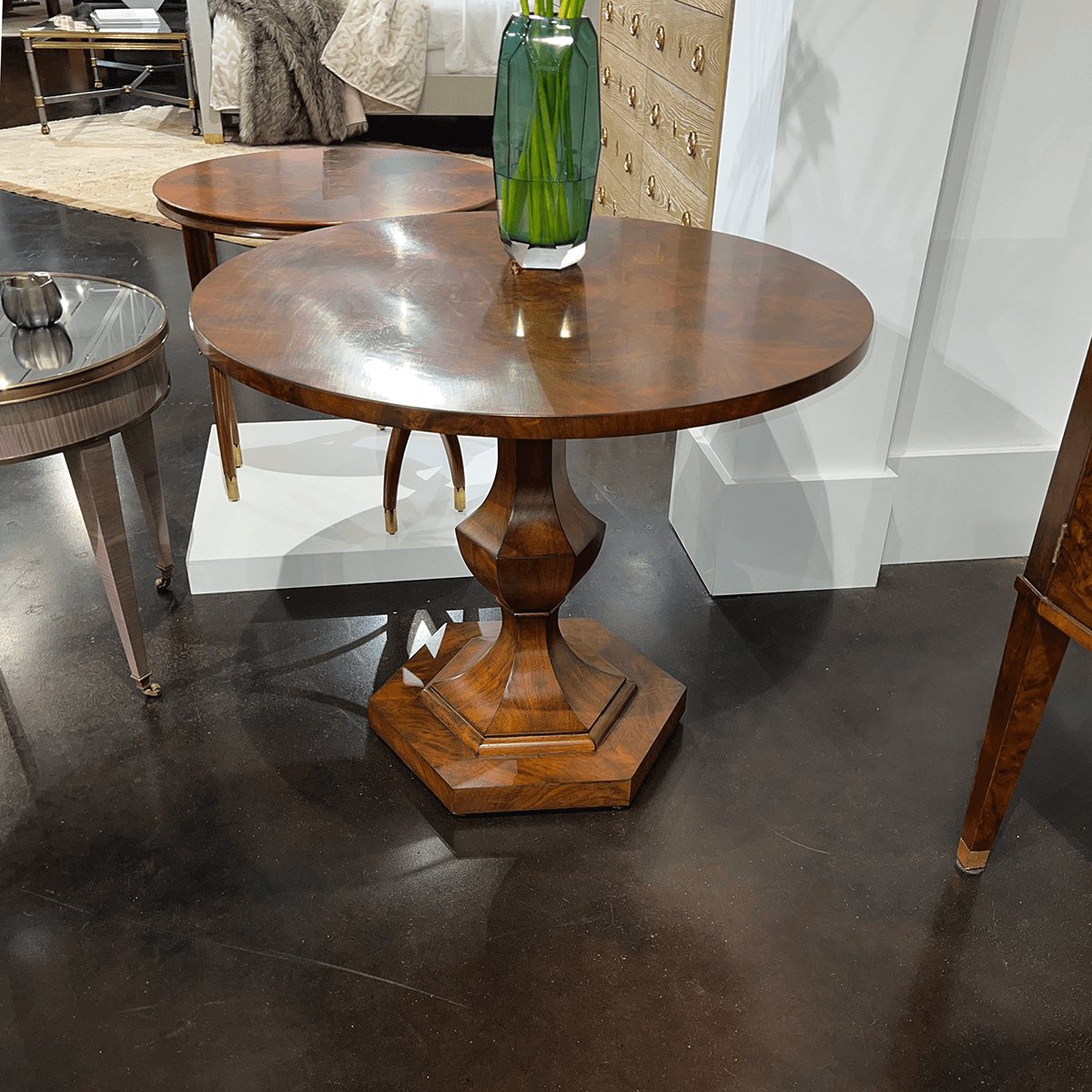 Biedermeier center table in contemporary showroom setting.