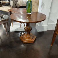 Biedermeier center table in contemporary showroom setting.