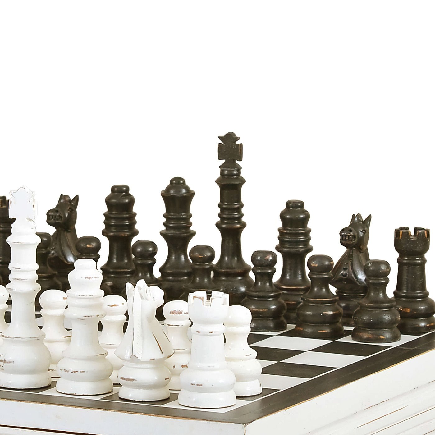Close-up of chess pieces on black and white board.